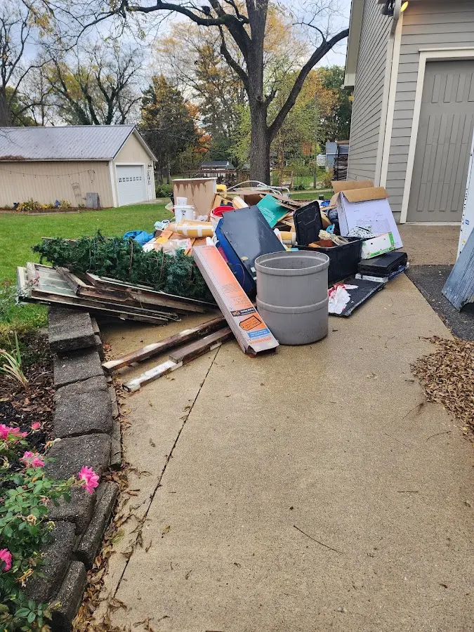 Dumpster being loaded with debris for 30 Yard Dumpster Rental in North Canaan